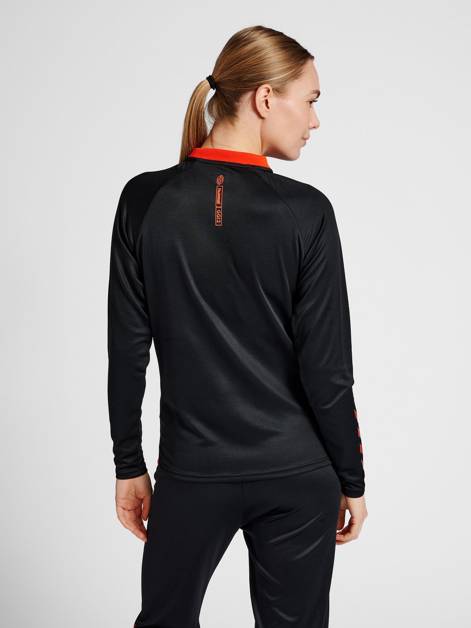 hmlGG12 ACTION HALF ZIP SWEAT WOMAN